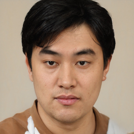 Neutral asian young-adult male with short  black hair and brown eyes