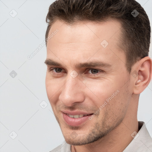 Joyful white young-adult male with short  brown hair and brown eyes