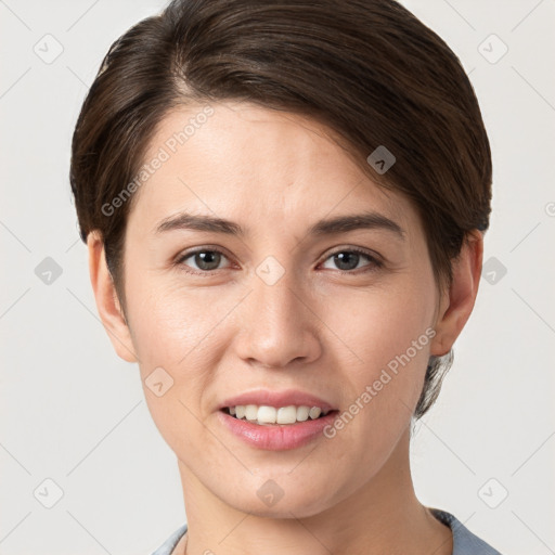 Joyful white young-adult female with short  brown hair and brown eyes