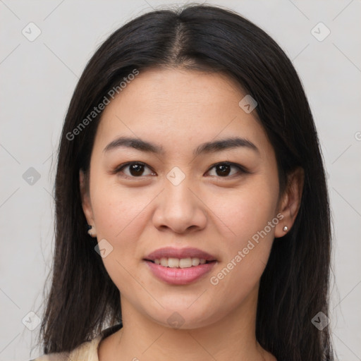 Joyful asian young-adult female with long  brown hair and brown eyes