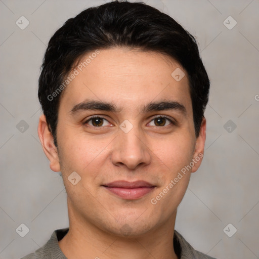 Joyful white young-adult male with short  black hair and brown eyes