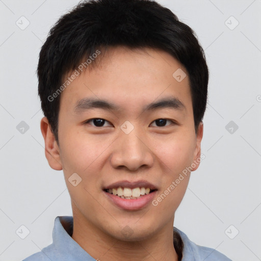 Joyful asian young-adult male with short  brown hair and brown eyes