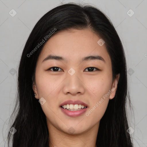 Joyful asian young-adult female with long  black hair and brown eyes