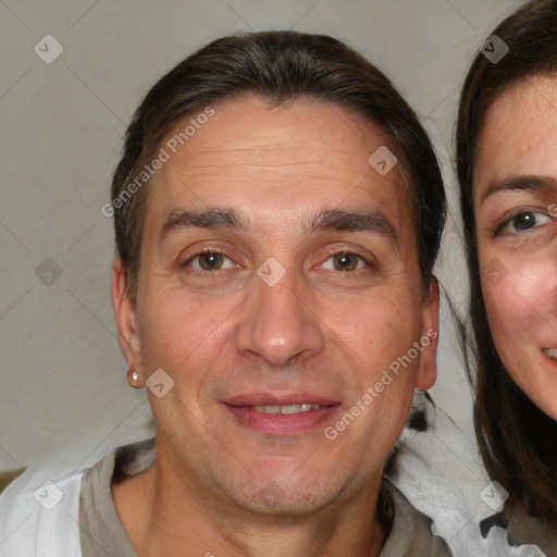 Joyful white adult male with short  brown hair and brown eyes