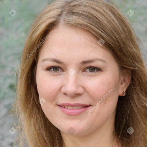 Joyful white young-adult female with long  brown hair and green eyes