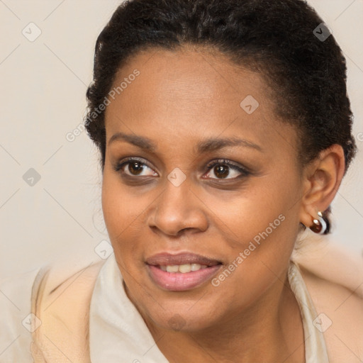 Joyful black young-adult female with medium  brown hair and brown eyes