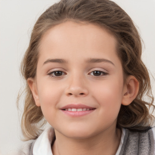 Joyful white child female with medium  brown hair and brown eyes