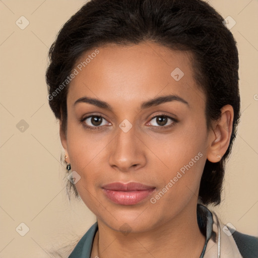 Joyful latino young-adult female with long  brown hair and brown eyes