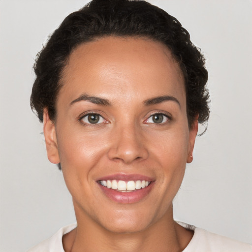 Joyful white young-adult female with short  brown hair and brown eyes