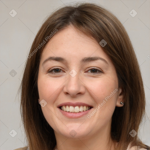 Joyful white adult female with medium  brown hair and brown eyes