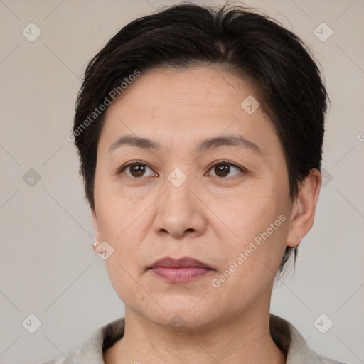 Joyful white adult female with short  brown hair and brown eyes