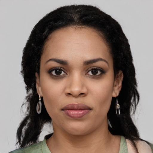 Joyful latino young-adult female with medium  black hair and brown eyes