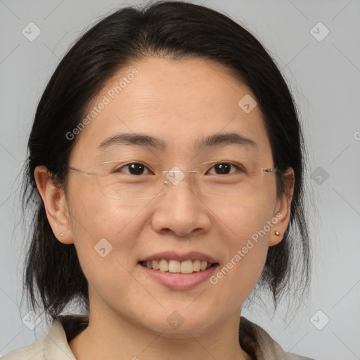 Joyful white adult female with medium  brown hair and brown eyes