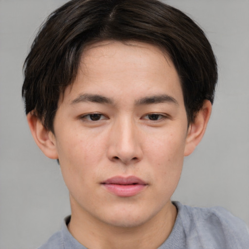 Neutral asian young-adult male with short  brown hair and brown eyes