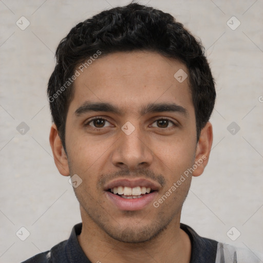 Joyful white young-adult male with short  black hair and brown eyes