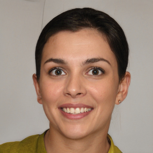 Joyful white young-adult female with short  brown hair and brown eyes