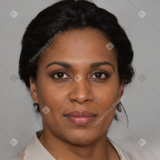 Joyful black adult female with short  brown hair and brown eyes