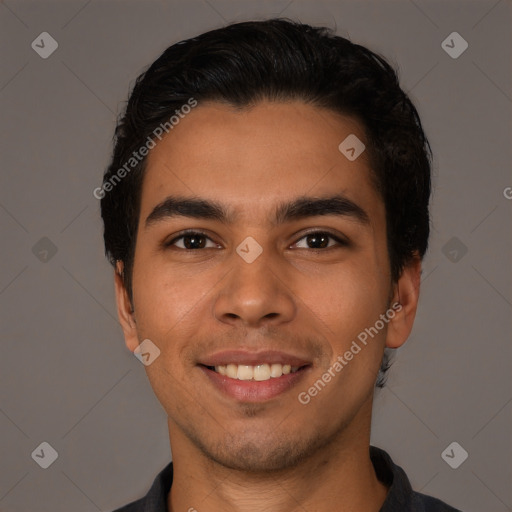 Joyful latino young-adult male with short  black hair and brown eyes