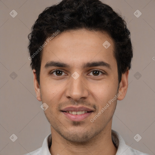 Joyful white young-adult male with short  black hair and brown eyes