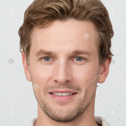 Joyful white young-adult male with short  brown hair and grey eyes