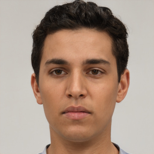 Neutral white young-adult male with short  black hair and brown eyes