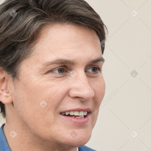 Joyful white adult male with short  brown hair and grey eyes