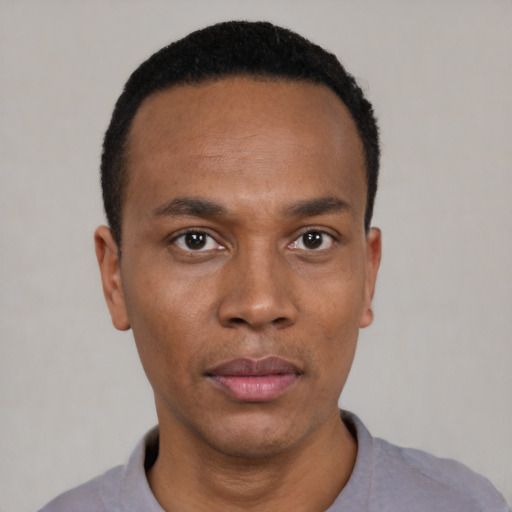 Neutral black young-adult male with short  black hair and brown eyes