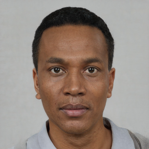 Neutral black young-adult male with short  black hair and brown eyes
