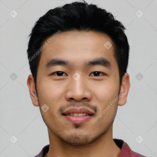 Joyful asian young-adult male with short  black hair and brown eyes