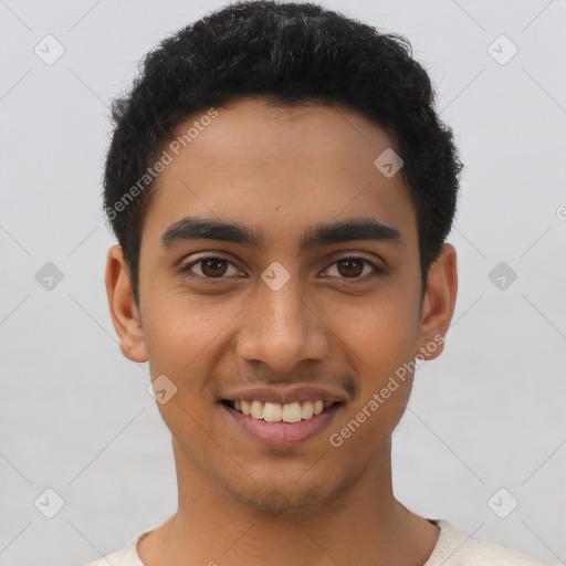 Joyful latino young-adult male with short  brown hair and brown eyes