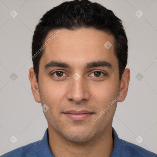 Joyful white young-adult male with short  black hair and brown eyes