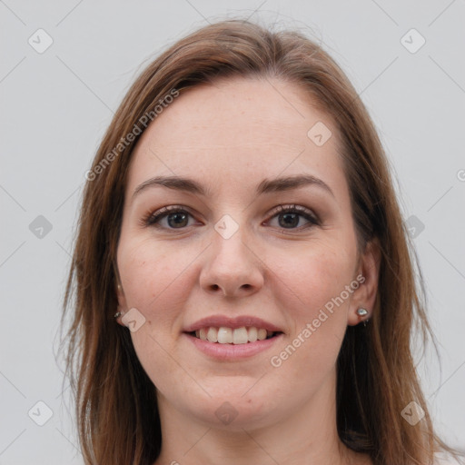 Joyful white young-adult female with long  brown hair and grey eyes