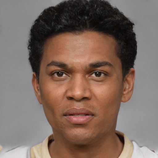 Neutral black young-adult male with short  black hair and brown eyes