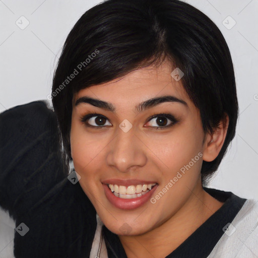 Joyful latino young-adult female with medium  black hair and brown eyes