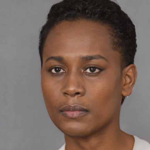 Neutral black young-adult female with short  brown hair and brown eyes