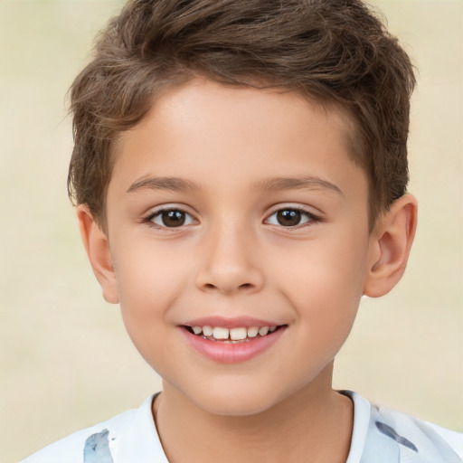 Joyful white child male with short  brown hair and brown eyes