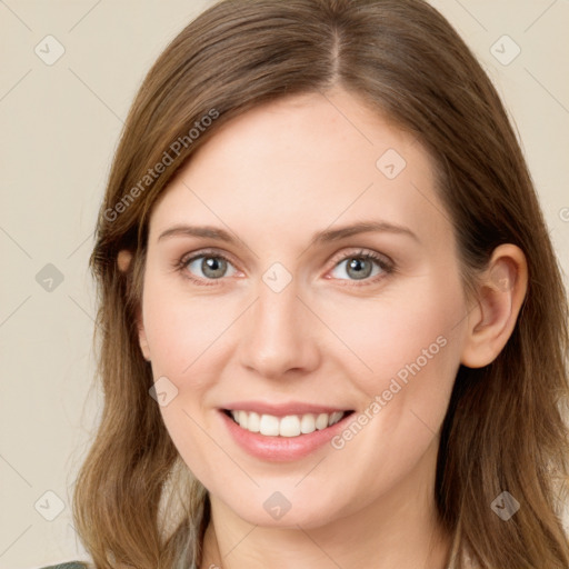 Joyful white young-adult female with long  brown hair and green eyes