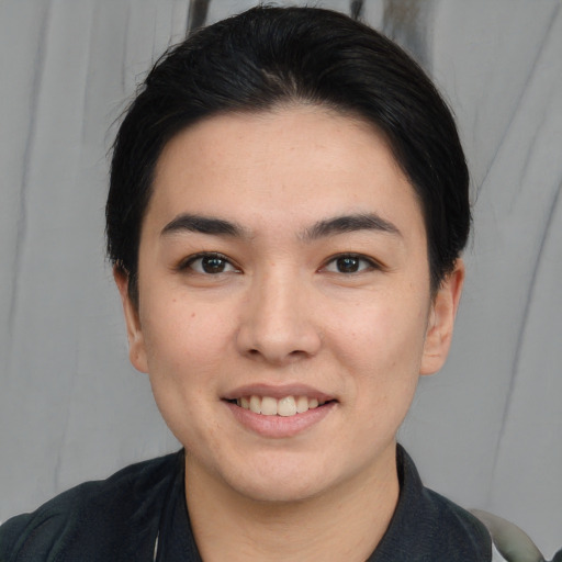 Joyful white young-adult female with short  black hair and brown eyes