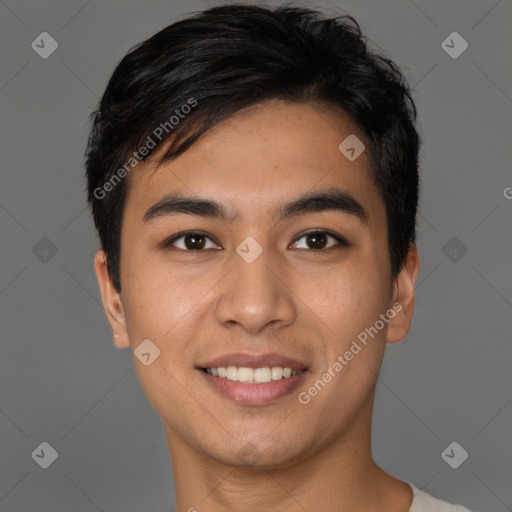 Joyful asian young-adult male with short  black hair and brown eyes