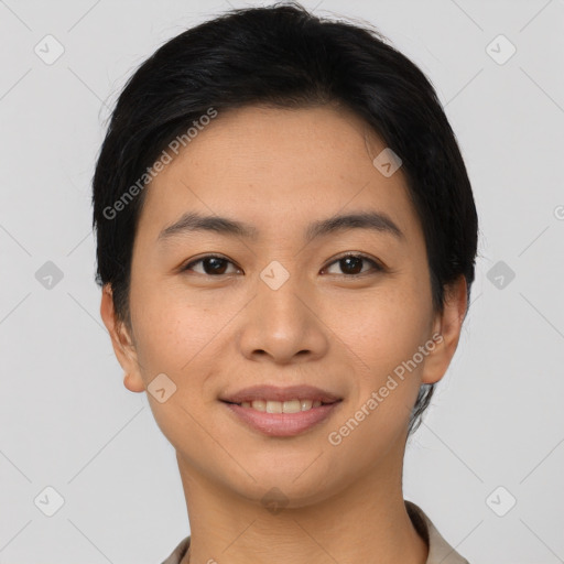 Joyful asian young-adult female with short  brown hair and brown eyes