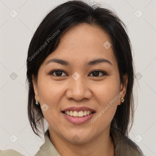 Joyful latino young-adult female with medium  brown hair and brown eyes