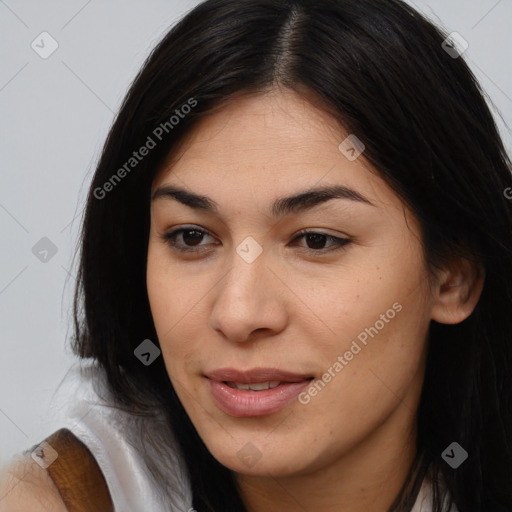 Joyful latino young-adult female with long  brown hair and brown eyes