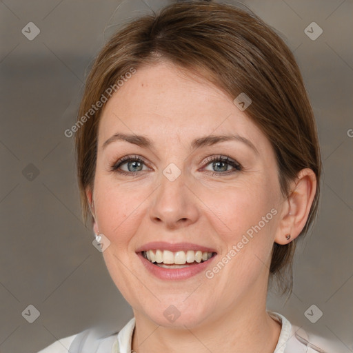 Joyful white adult female with medium  brown hair and grey eyes