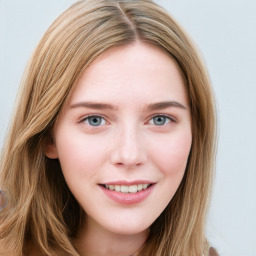 Joyful white young-adult female with long  brown hair and blue eyes