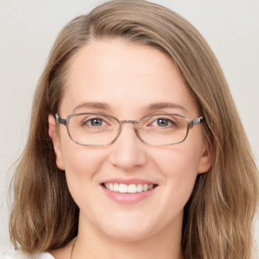 Joyful white adult female with medium  brown hair and grey eyes