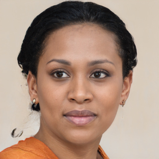 Joyful black young-adult female with short  brown hair and brown eyes