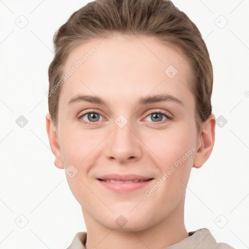 Joyful white young-adult female with short  brown hair and grey eyes