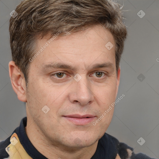 Joyful white adult male with short  brown hair and grey eyes