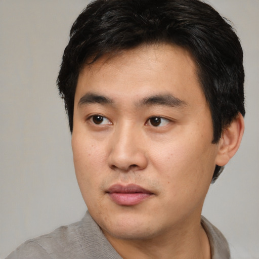 Neutral asian young-adult male with short  black hair and brown eyes