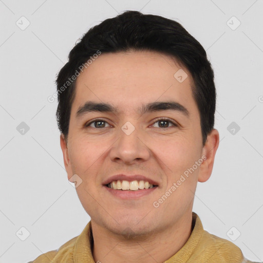 Joyful white young-adult male with short  black hair and brown eyes